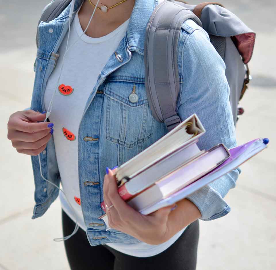 student-with-books-and-backpack